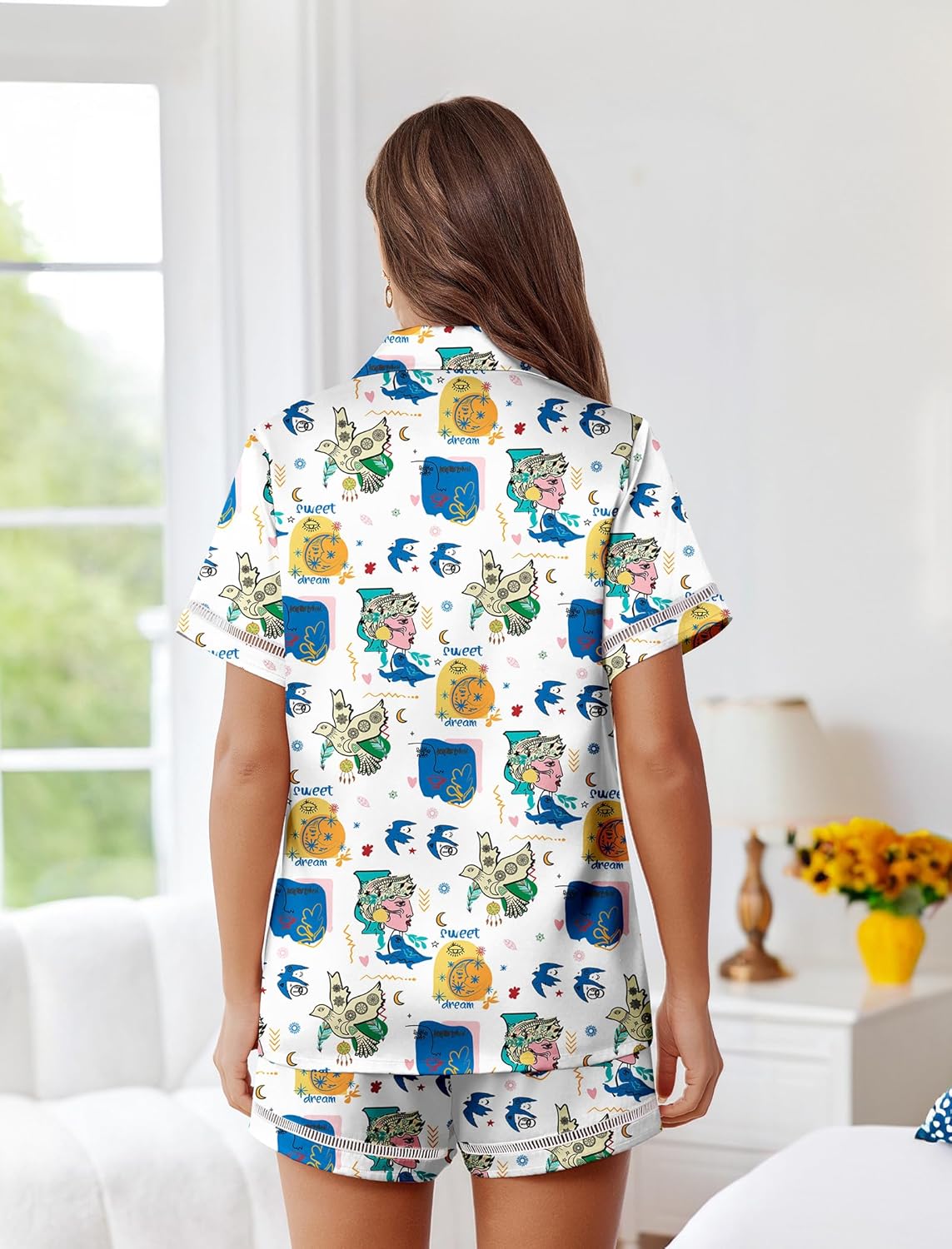Back view white satin pajama set with blue character print, button-up top and shorts
