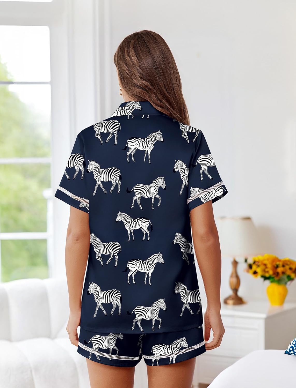 Back view navy zebra print satin pajama set with button-up top and shorts