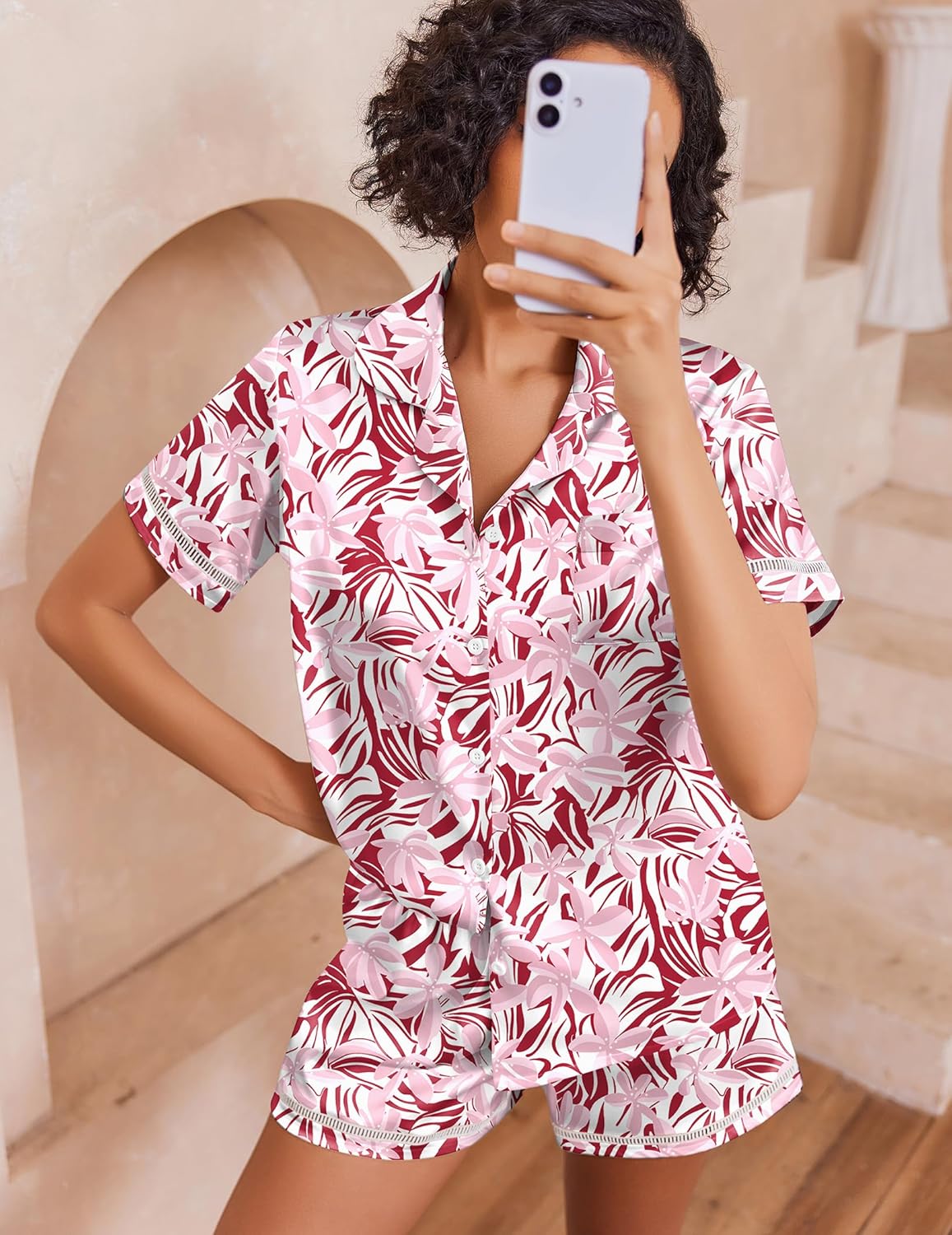 Pink and white leaf-print satin pajama set with button-up short sleeves and shorts