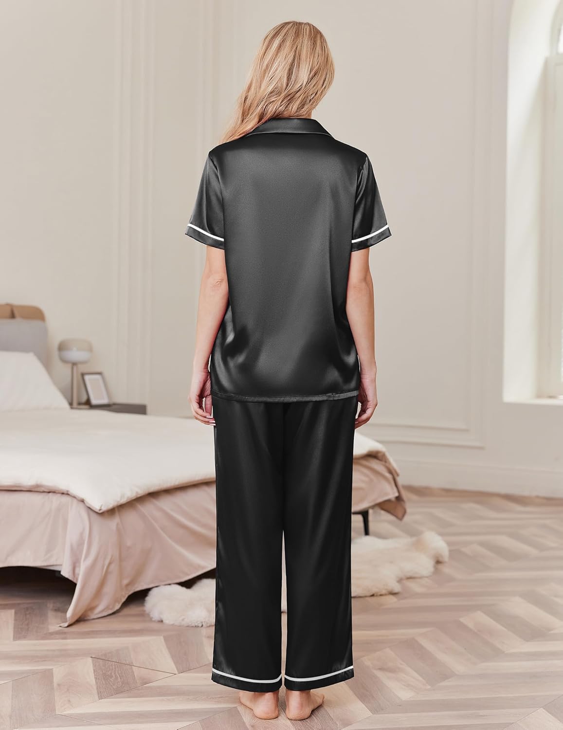 Black silk pajama set, short-sleeve satin top and wide-leg pants, back view