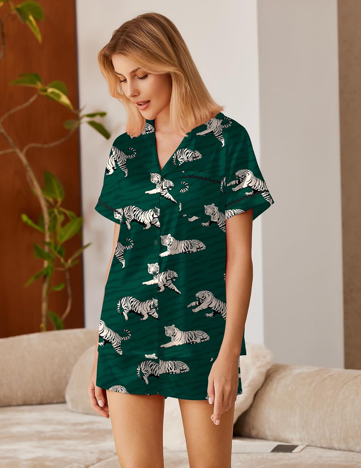 Green satin lounge set with animal print pattern, collared button top and matching shorts