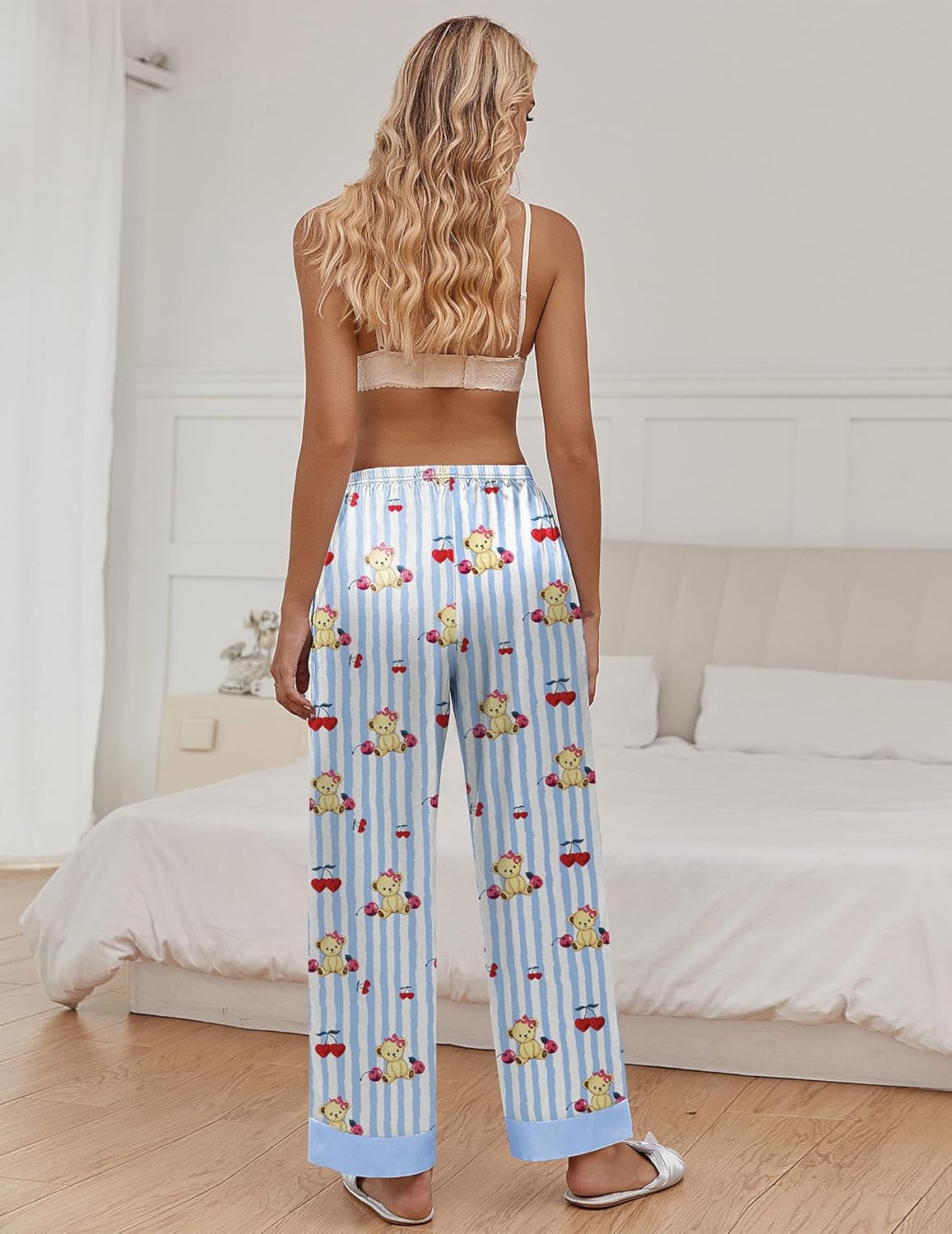 Blue striped pajama pants with teddy bear motif and bows, elastic waist, straight legs