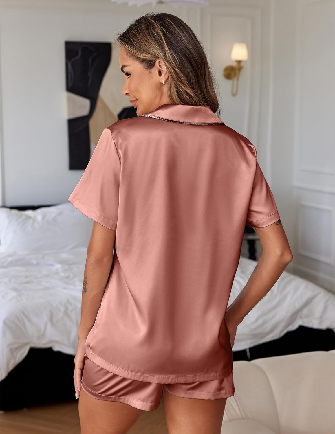 Pink satin pajama set: short-sleeve button top with matching shorts, back view