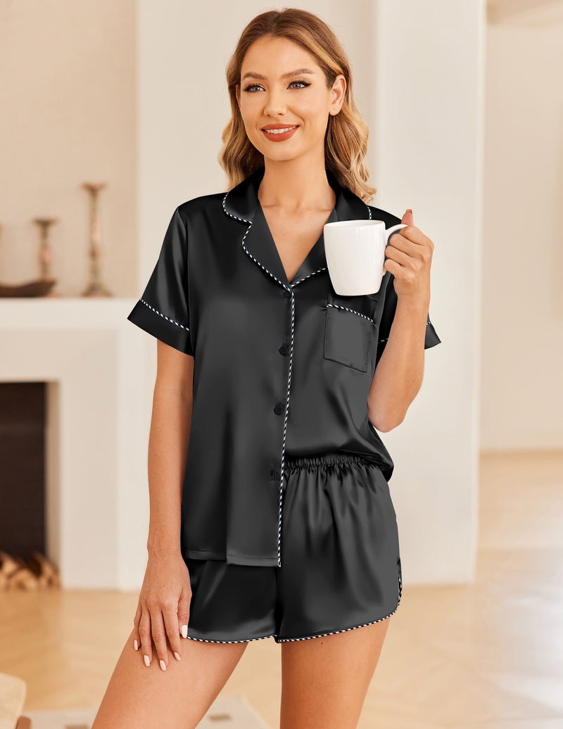 Silk satin pajama set, black short-sleeve button-up top with matching shorts