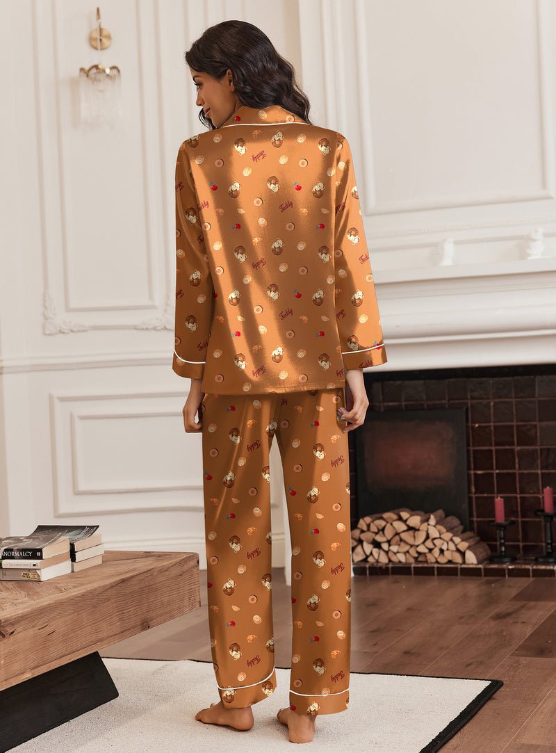 Brown silk satin pajama set with teddy bear print, long-sleeve top and full-length matching pants