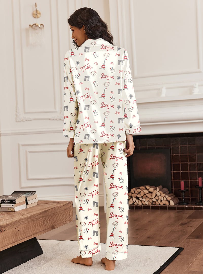 Silk pajama set, back view: button-up shirt and long pants in white with bear icons