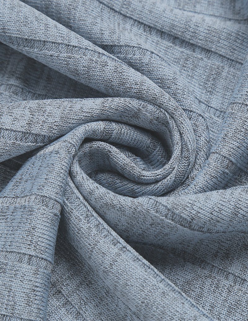Close-up of light grey ribbed knit fabric with soft texture and subtle vertical pattern
