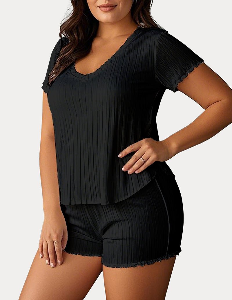 Black textured pajama set: V-neck short-sleeve top and matching shorts with scalloped hem