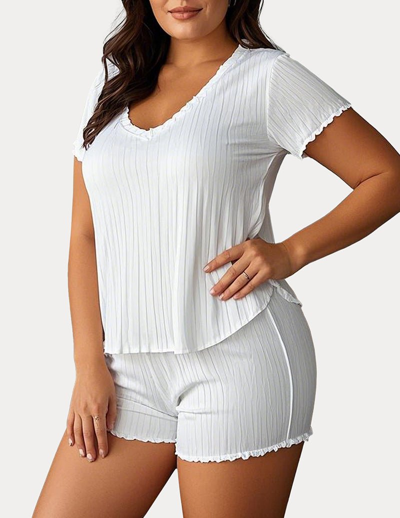 White textured pajama set: V-neck short-sleeve top and matching shorts with scalloped hem