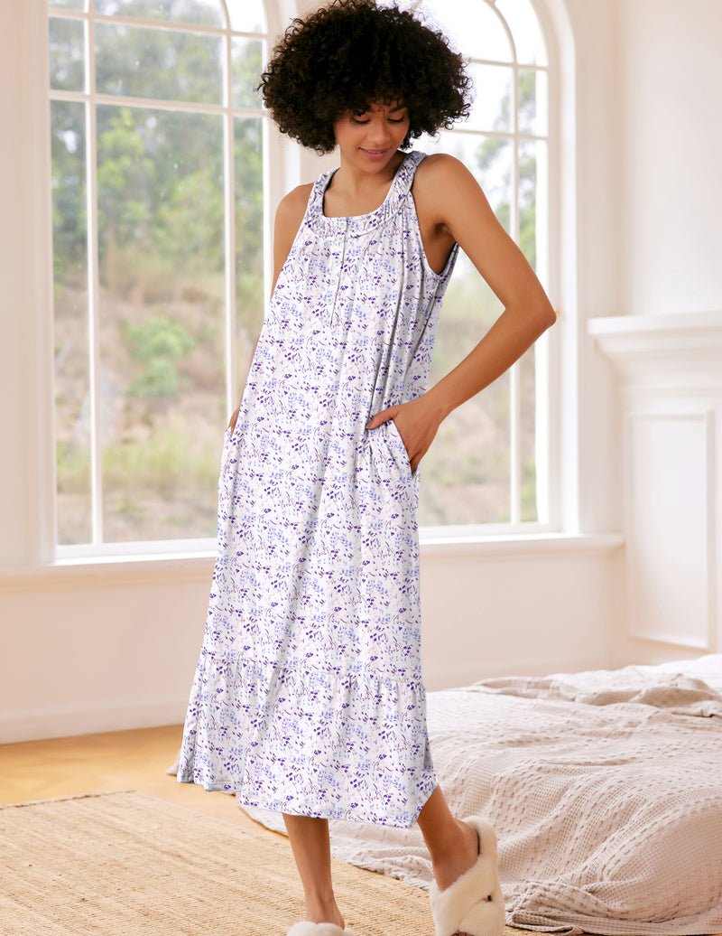 Sleeveless nightdress with pockets, white base with purple print, button front and tiered hem
