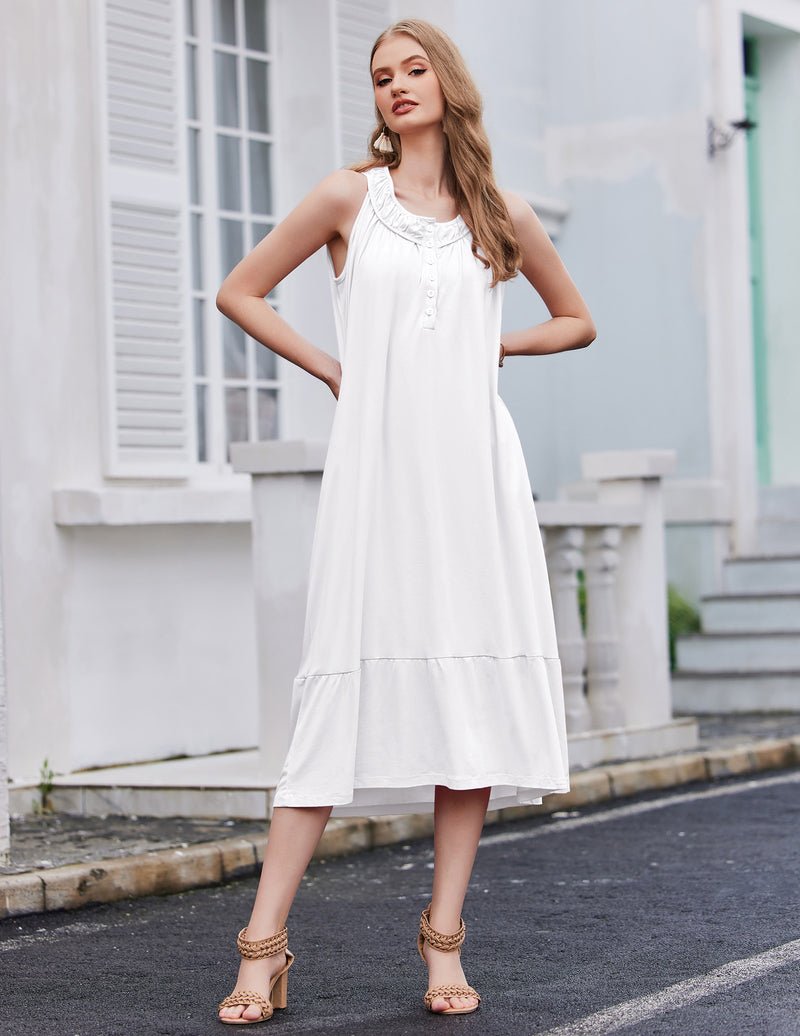 White sleeveless nightdress with button placket and tiered hem
