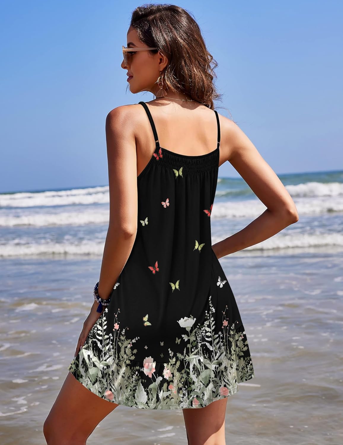 Sleeveless sleep chemise back view in black with floral and banded hem