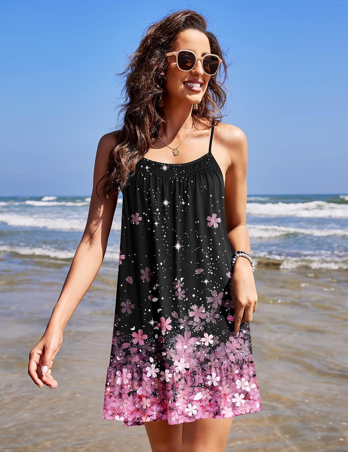 Sleeveless black night chemise dress with thin straps and pink floral tiered hem