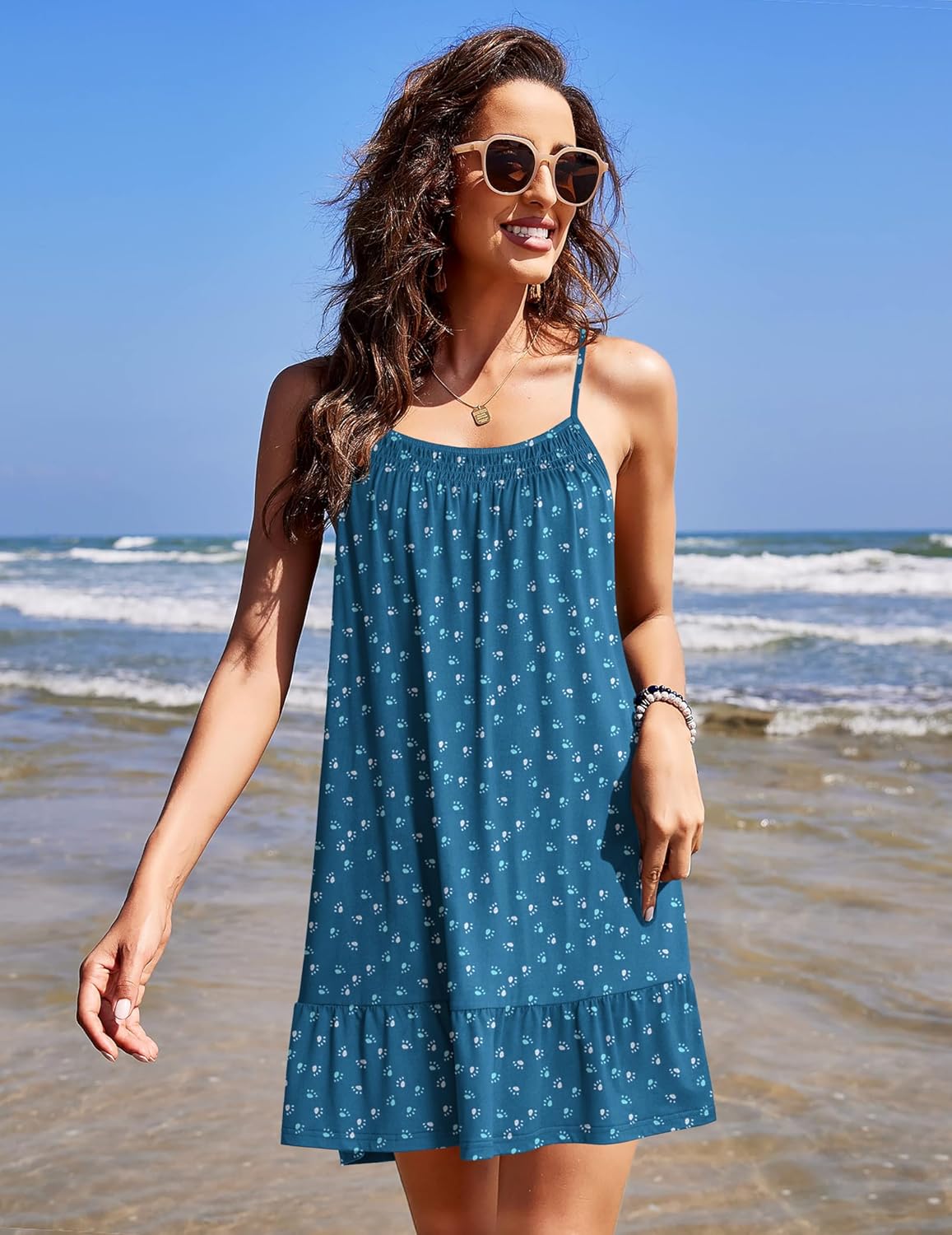 Front view of sleeveless teal night chemise dress with thin straps and tiered hem