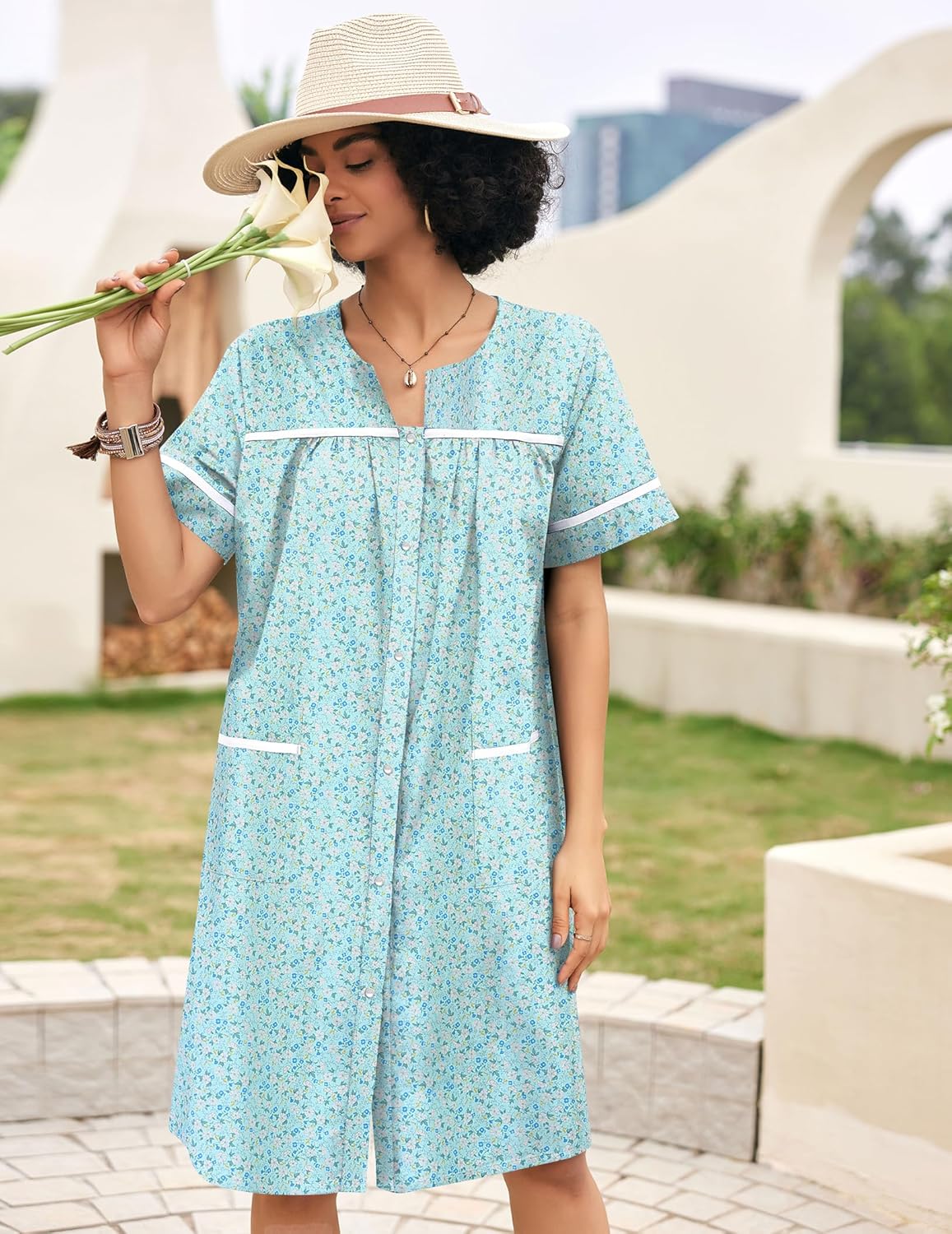 Light aqua cotton snap-front house dress with short sleeves and white trim pockets