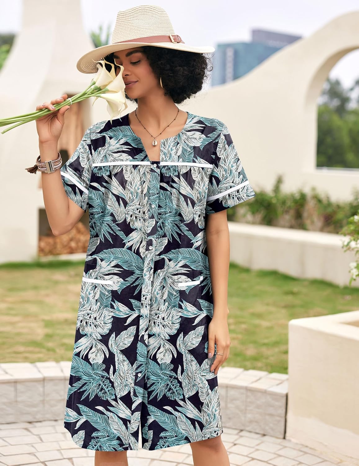 Teal and navy leaf-print cotton snap-front house dress with short sleeves