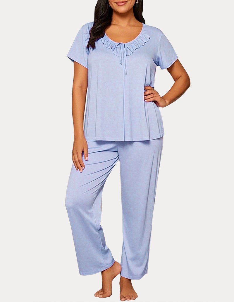 Light blue pajama set: short-sleeve top with ruffled neckline and drawstring; cropped pants