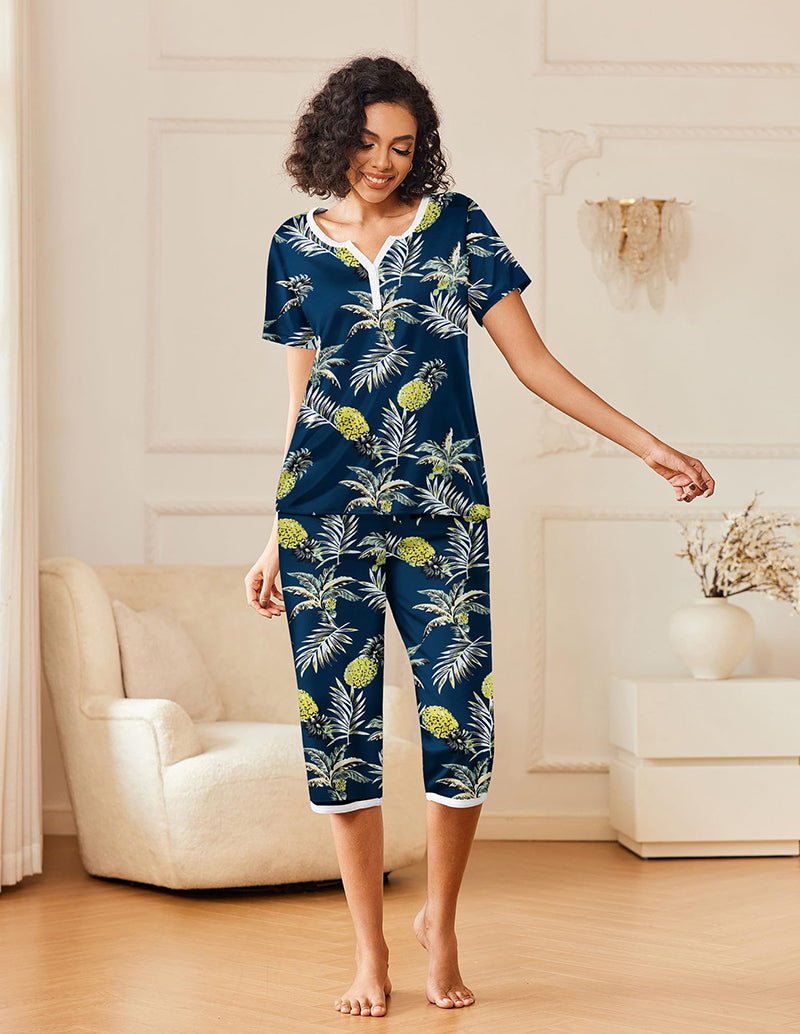 Navy printed pajama set with pineapple-and-leaf pattern, short-sleeve henley and capri pants
