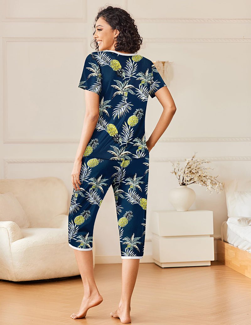 Navy tropical printed pajama set with short sleeves and cropped pants, white trim