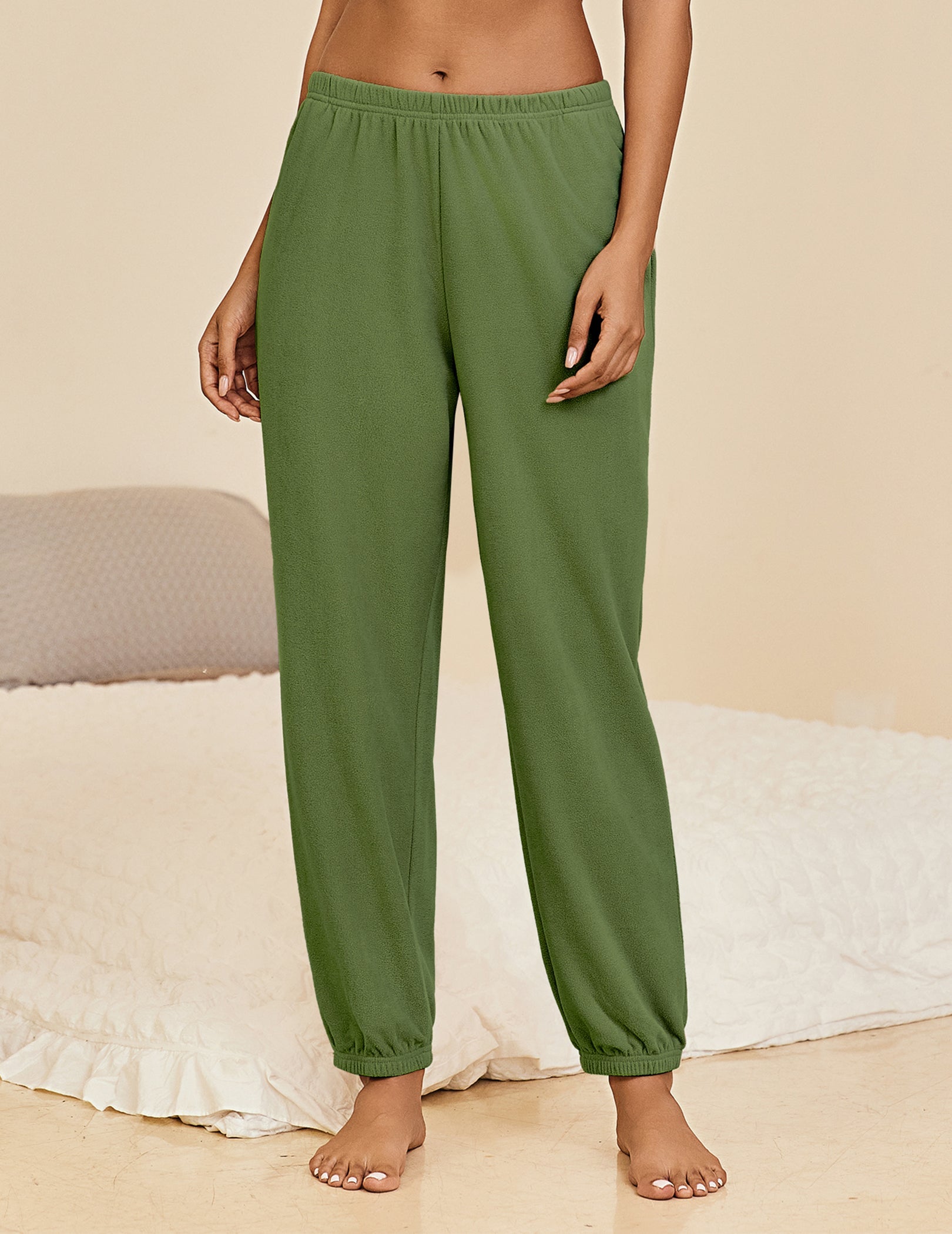 Army green lounge pants with elastic waistband and cuffed ankle hems, relaxed fit