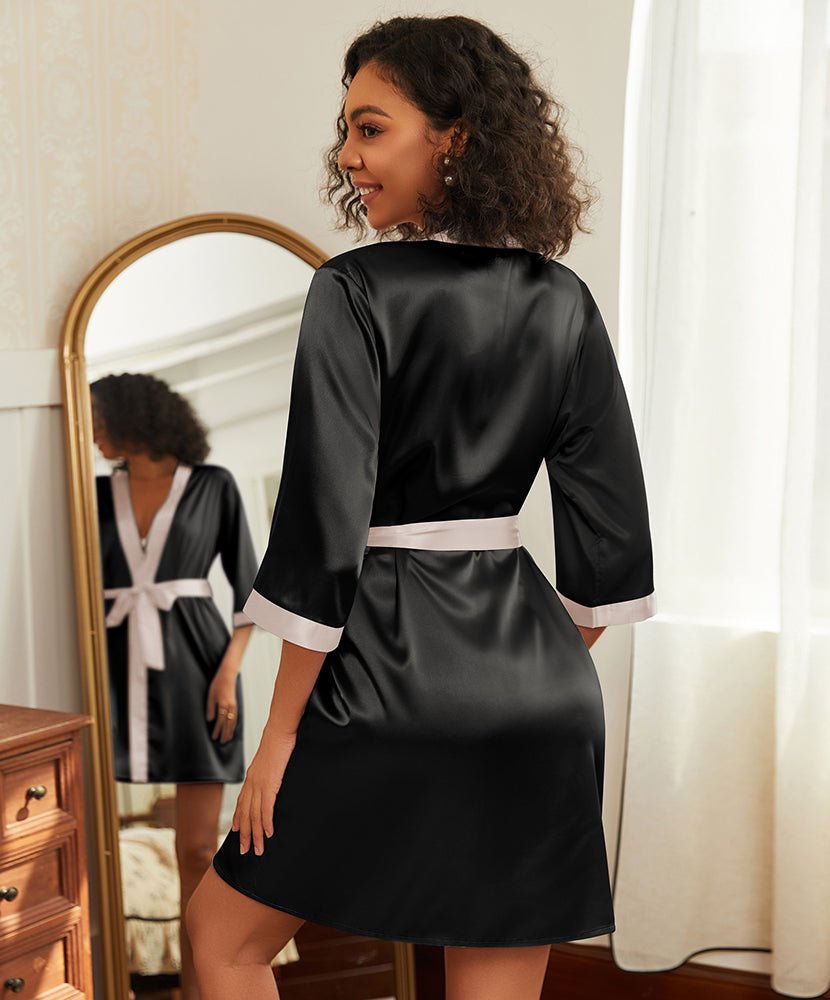 Black satin kimono bathrobe with white trim and tied waist sash, 3/4 sleeves
