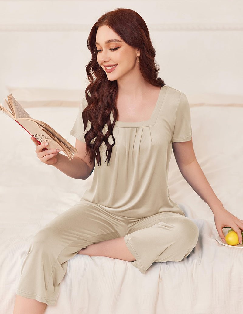 Soft square-neck pajama set in khaki beige: short-sleeve top and cropped pants, seated
