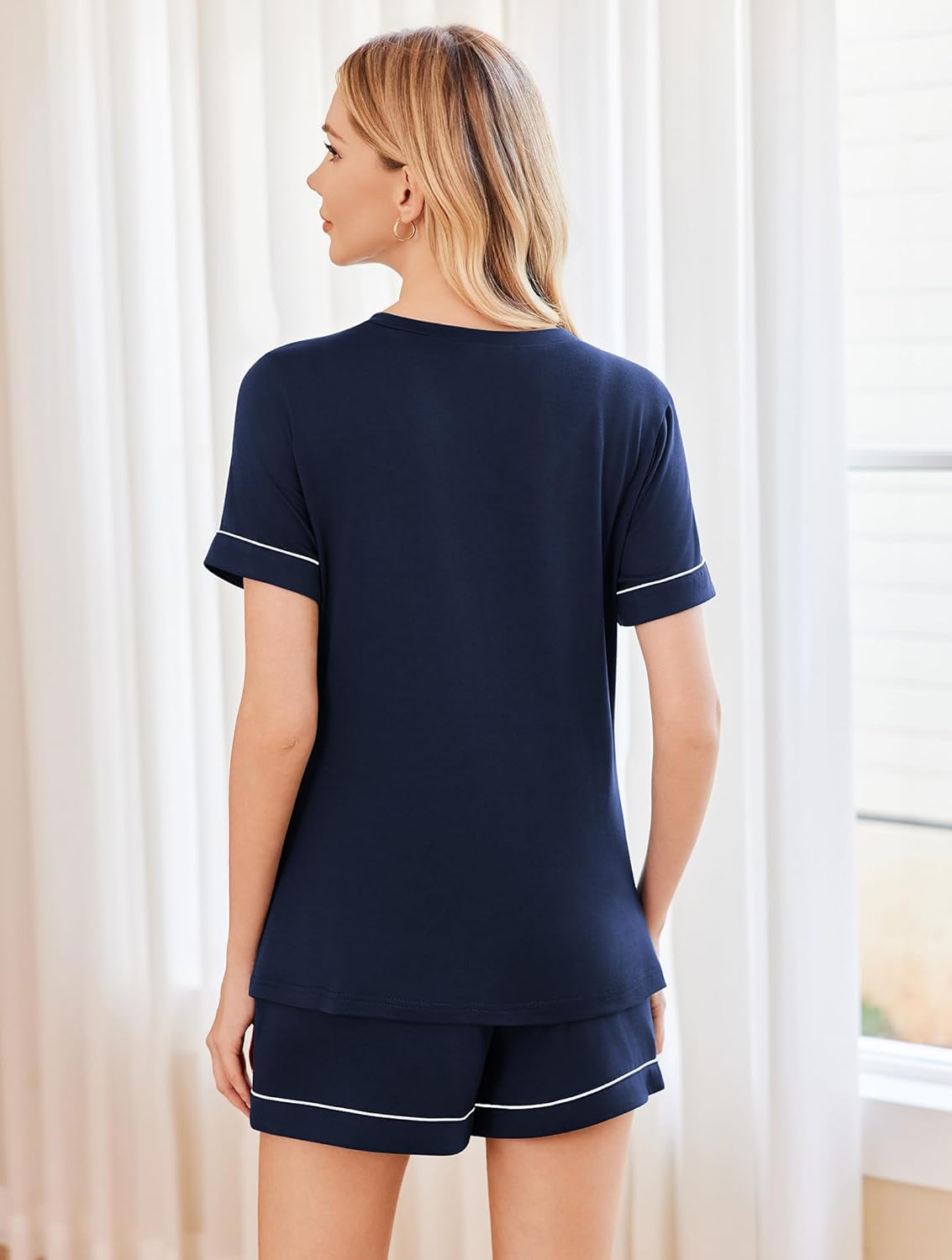 Women’s v-neck pajama set with dark navy top and matching short shorts, short sleeves