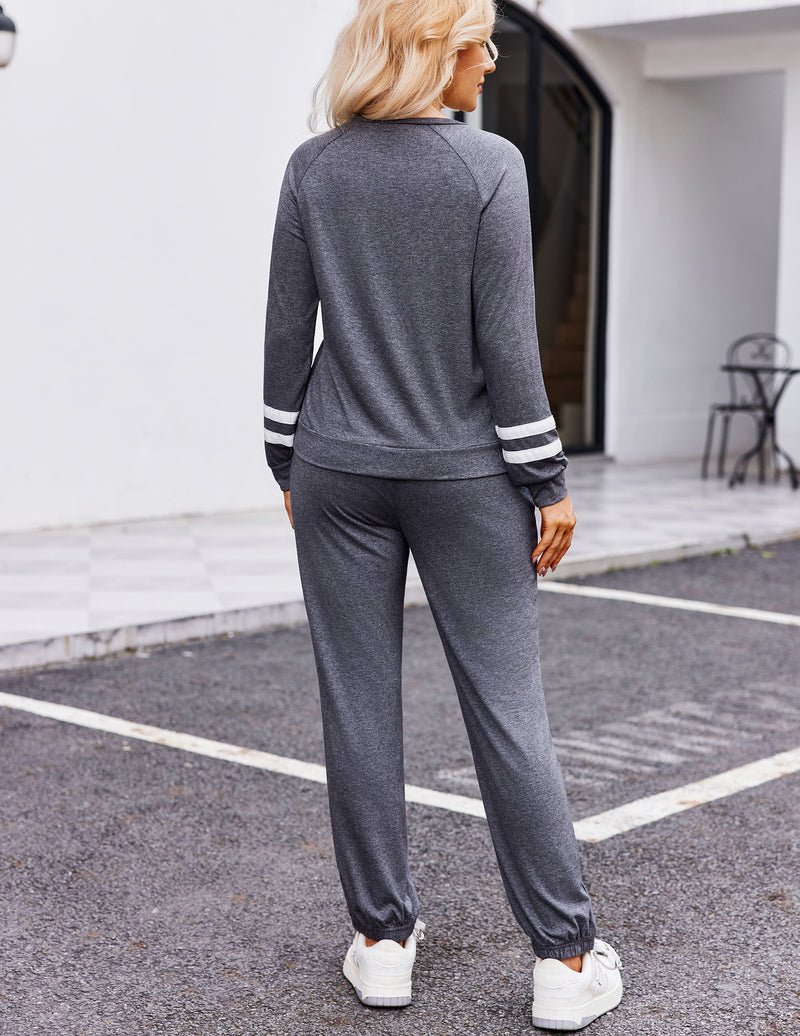 Grey pajama set from the back: long-sleeve top with striped cuffs and jogger pants