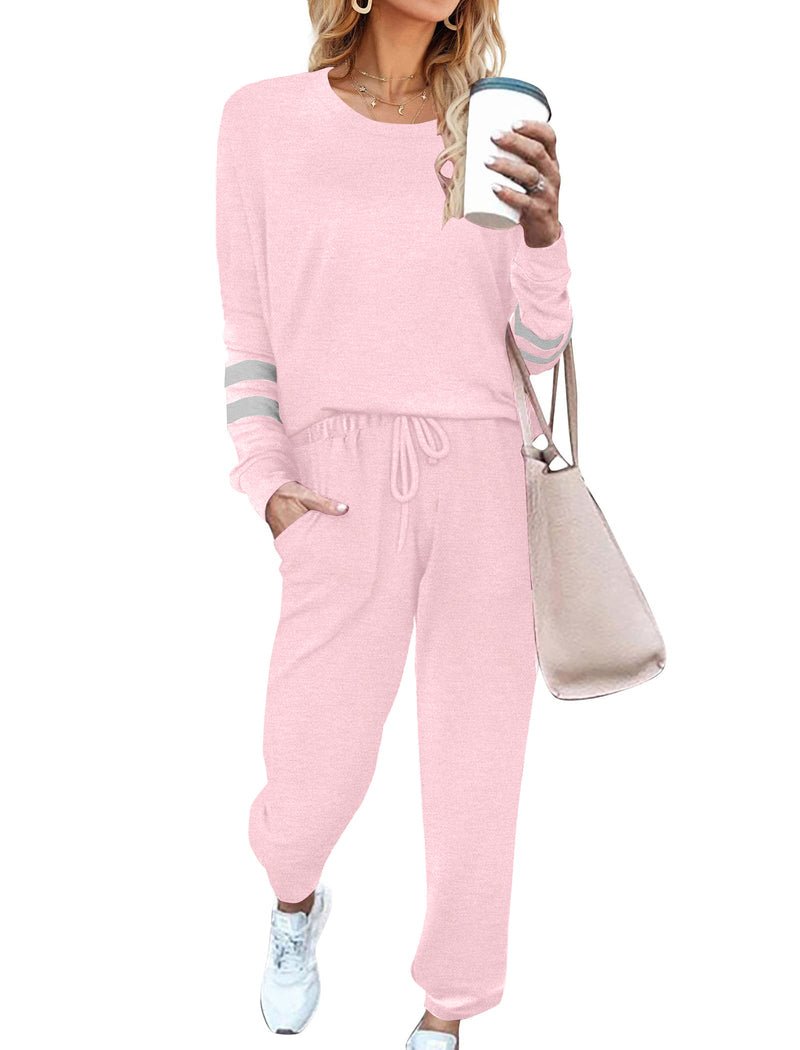 Light pink 2-piece pajama set with long sleeves, striped cuffs, and drawstring jogger pants