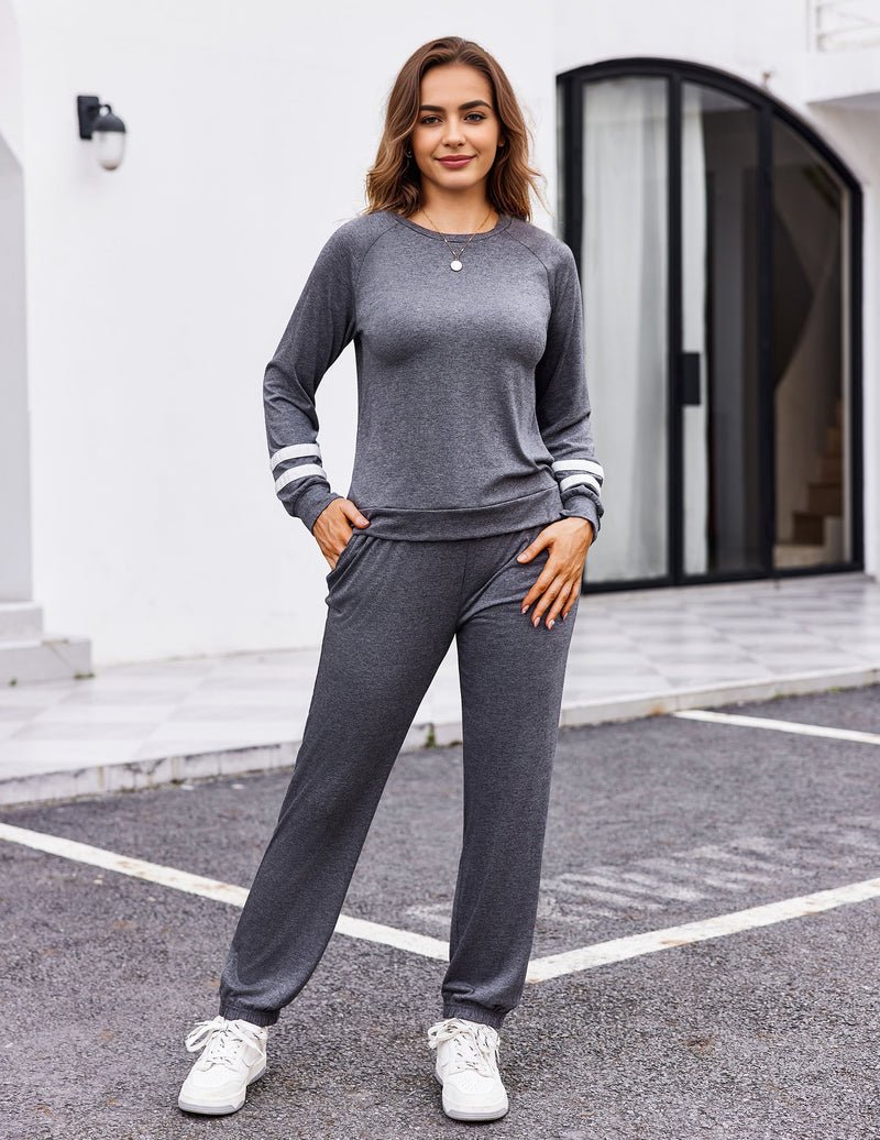 Grey 2-piece lounge set with long sleeves, striped cuffs, and drawstring jogger pants