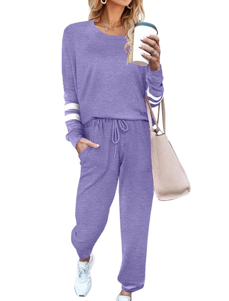 Purple pajama set with long sleeves, striped cuffs, and drawstring jogger pants