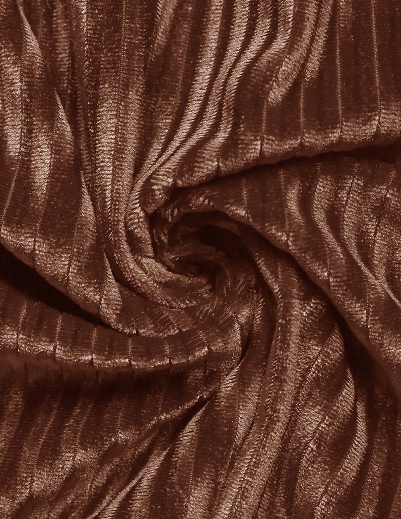 Brown pleated fabric close-up with gathered, textured drape