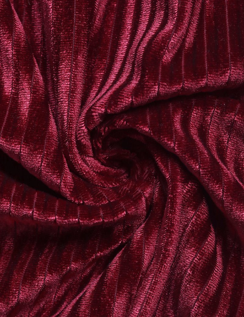 Wine red pleated fabric close-up with soft ruching texture