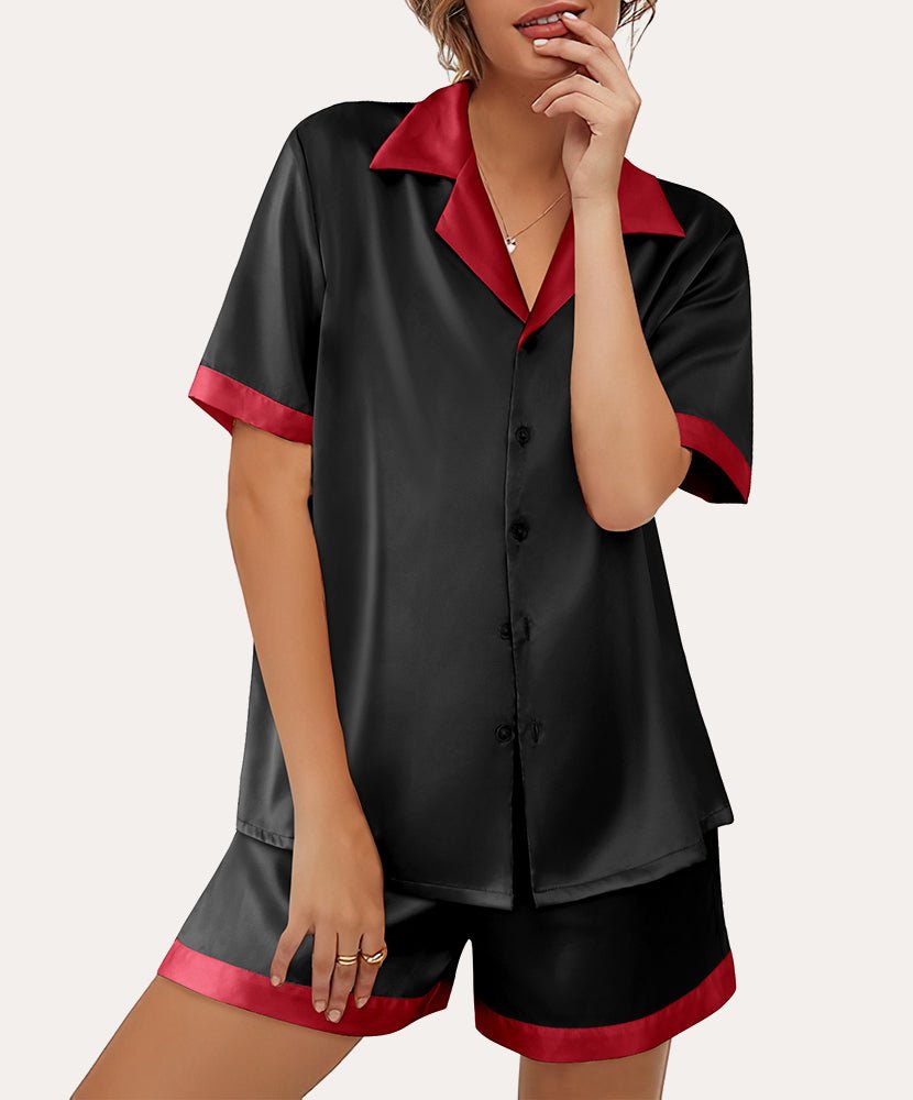 Black satin button-down pajama set with red collar trim and matching shorts, front buttons.