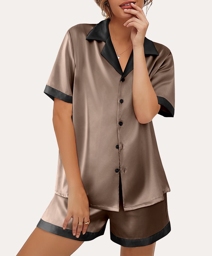 Beige satin button-down pajama set with dark collar trim and matching shorts, front buttons.
