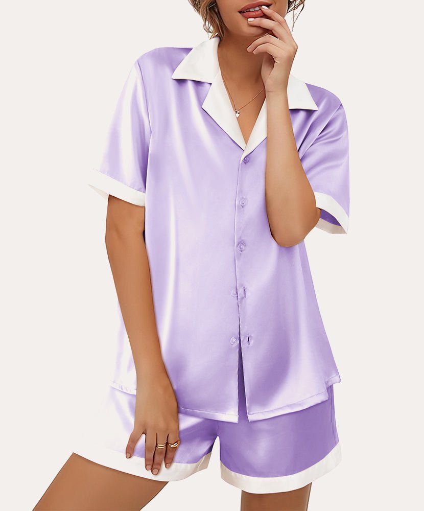 Purple satin button-down pajama set with short sleeves and matching shorts