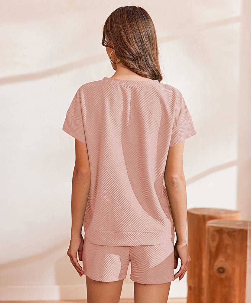 Pink textured lounge set showing back with short sleeves and drawstring shorts