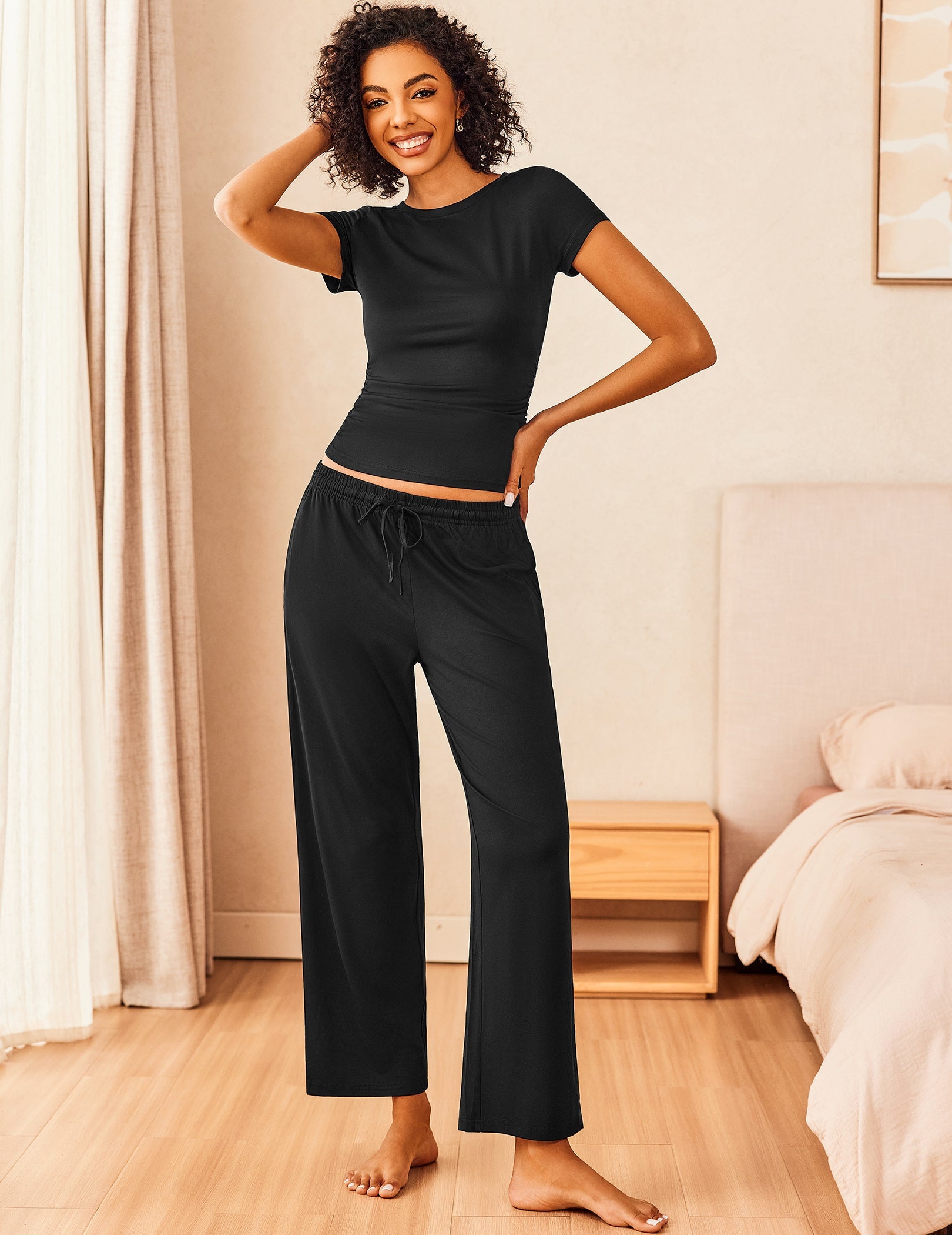 Super-soft lounge set in black: short-sleeve top and wide-leg drawstring pants.
