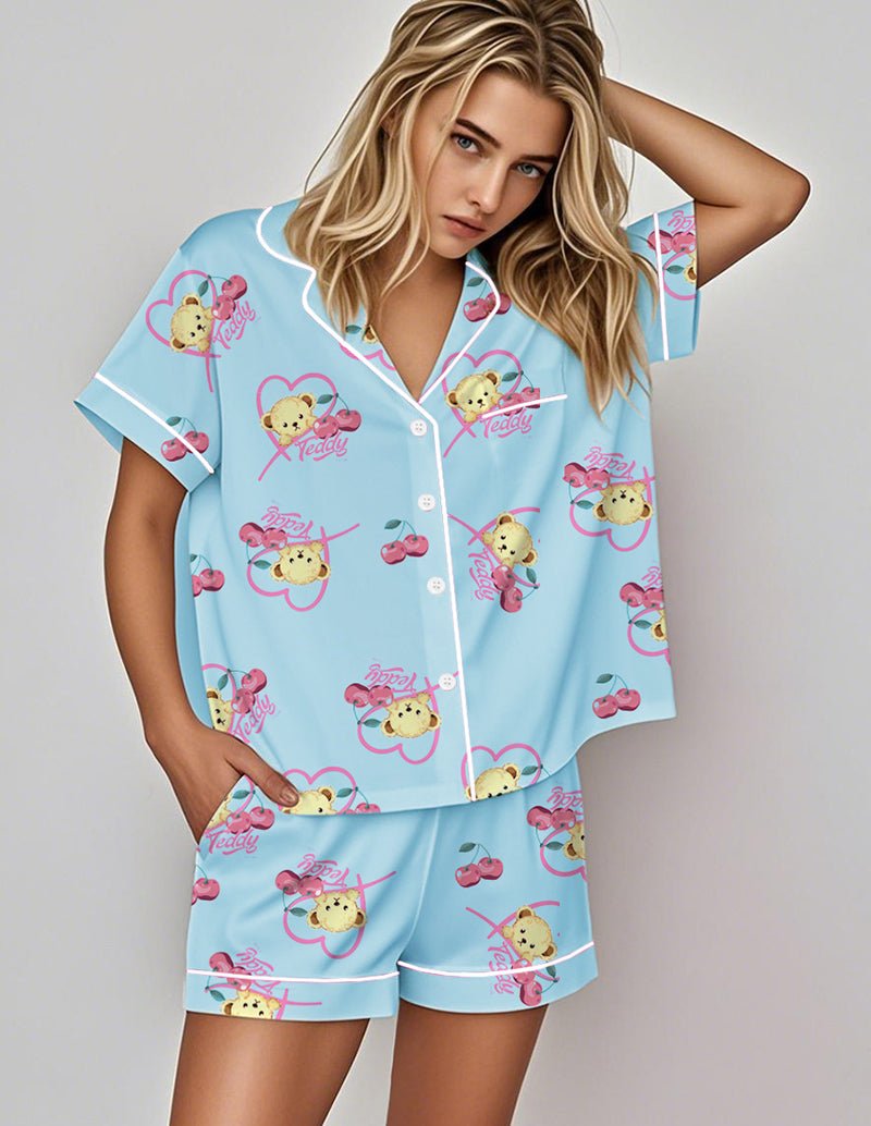 Satin pajama set: blue short-sleeve button top and matching shorts with teddy print