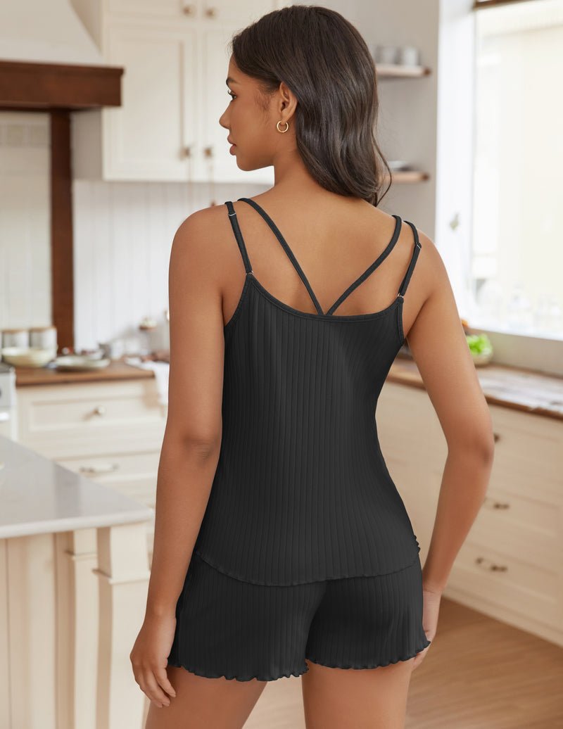Back view: black ribbed tank with crisscross straps and matching shorts
