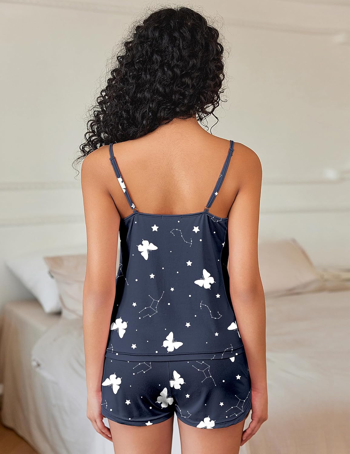 Navy pajama set back view, white stars and butterflies print, cami straps and matching shorts