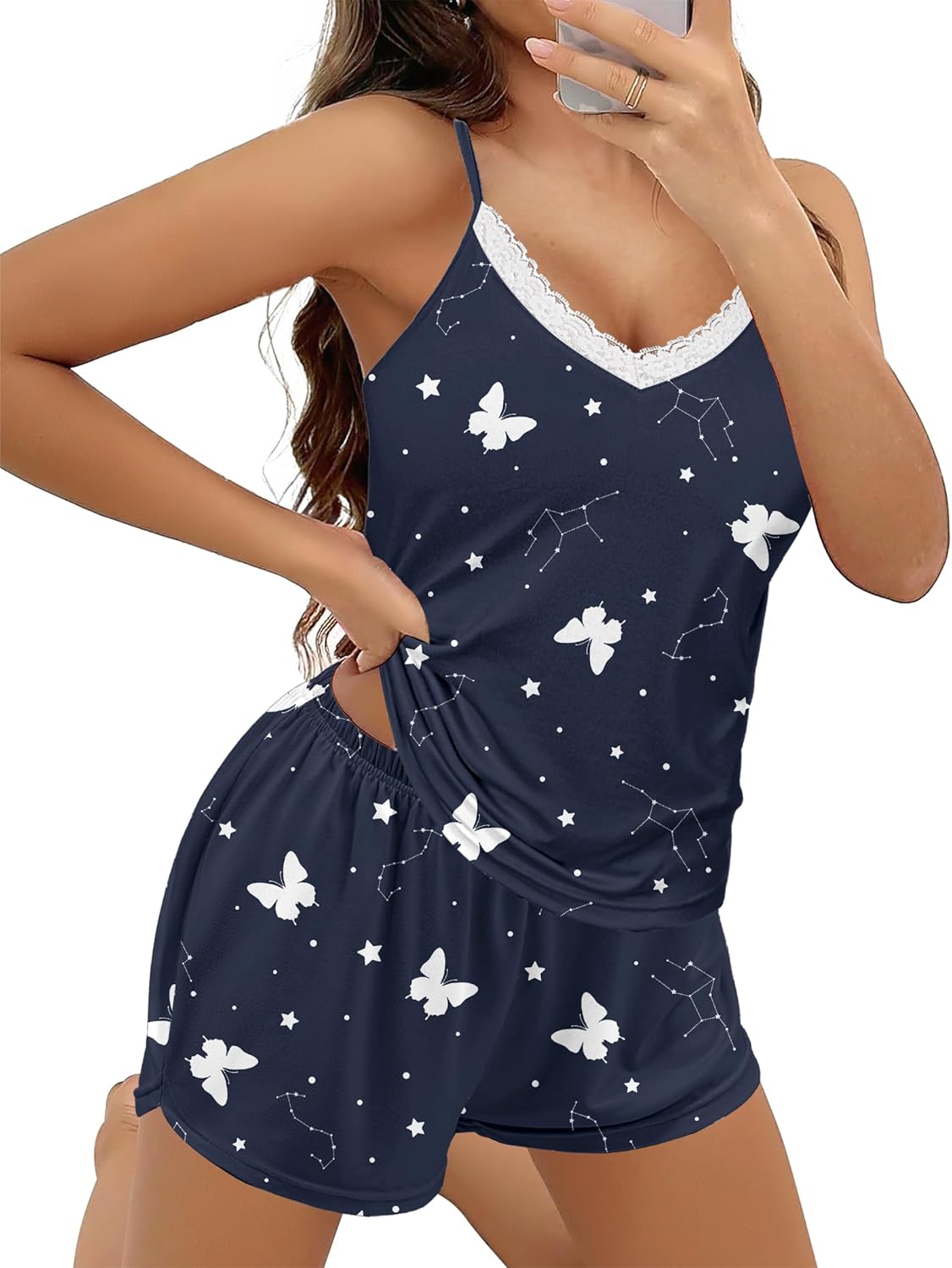 Navy two-piece pajama set with white stars and butterflies; lace-trim cami and shorts