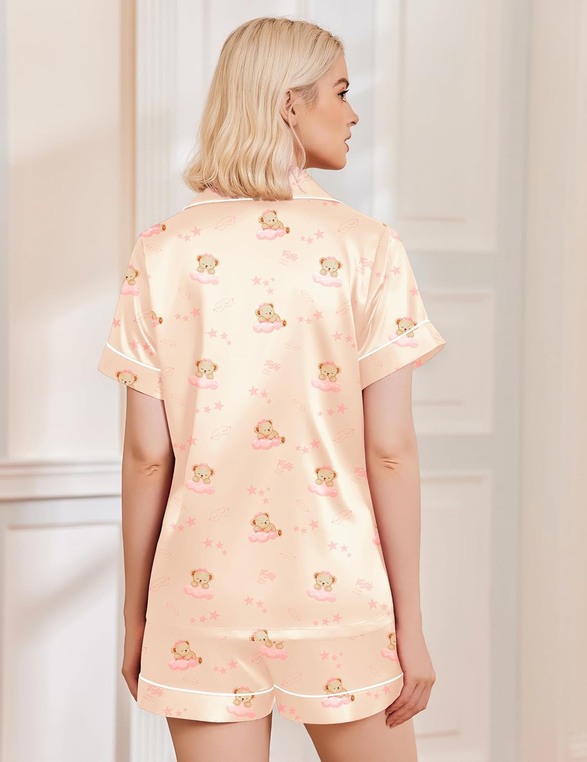 Light pink satin teddy pajama set with button-front top and shorts