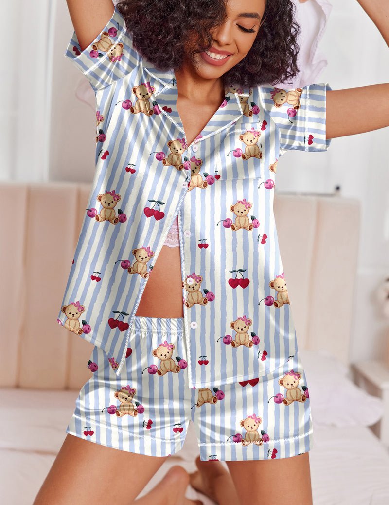 Blue striped satin pajama set with teddy and heart motifs, button-up top and matching shorts