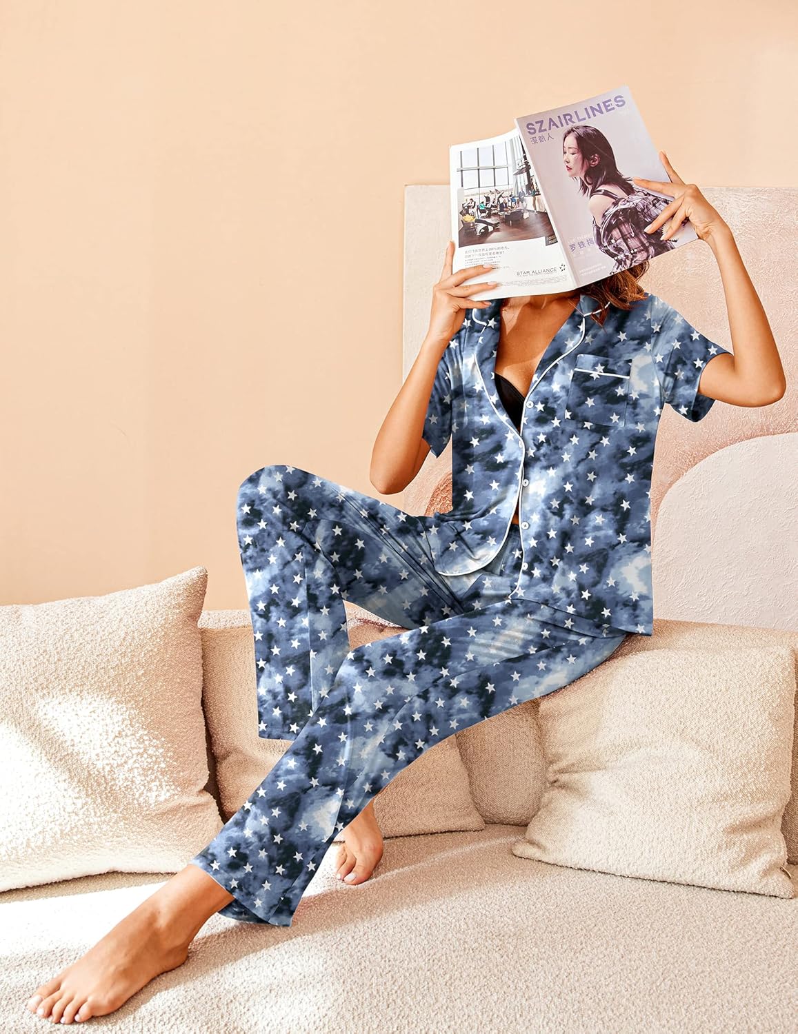Blue star-print pajama set, short-sleeve top and long pants, lounging pose