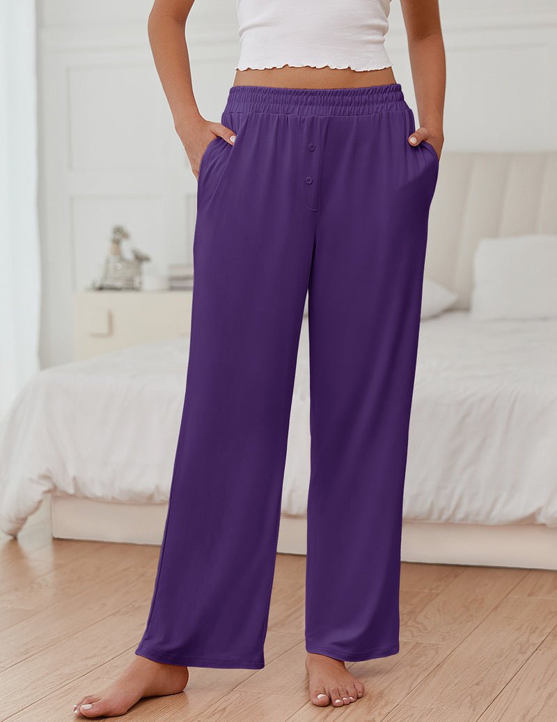 Purple solid pajama pants with elastic waistband and wide, flowing legs