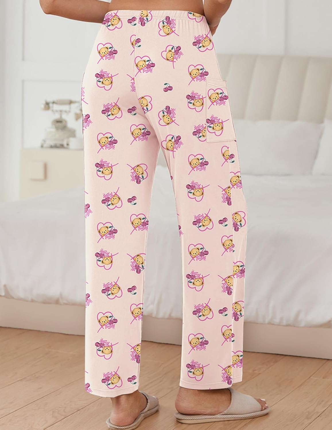 Light apricot teddy pajama pants with repeating cute animals, elastic waist, relaxed wide fit