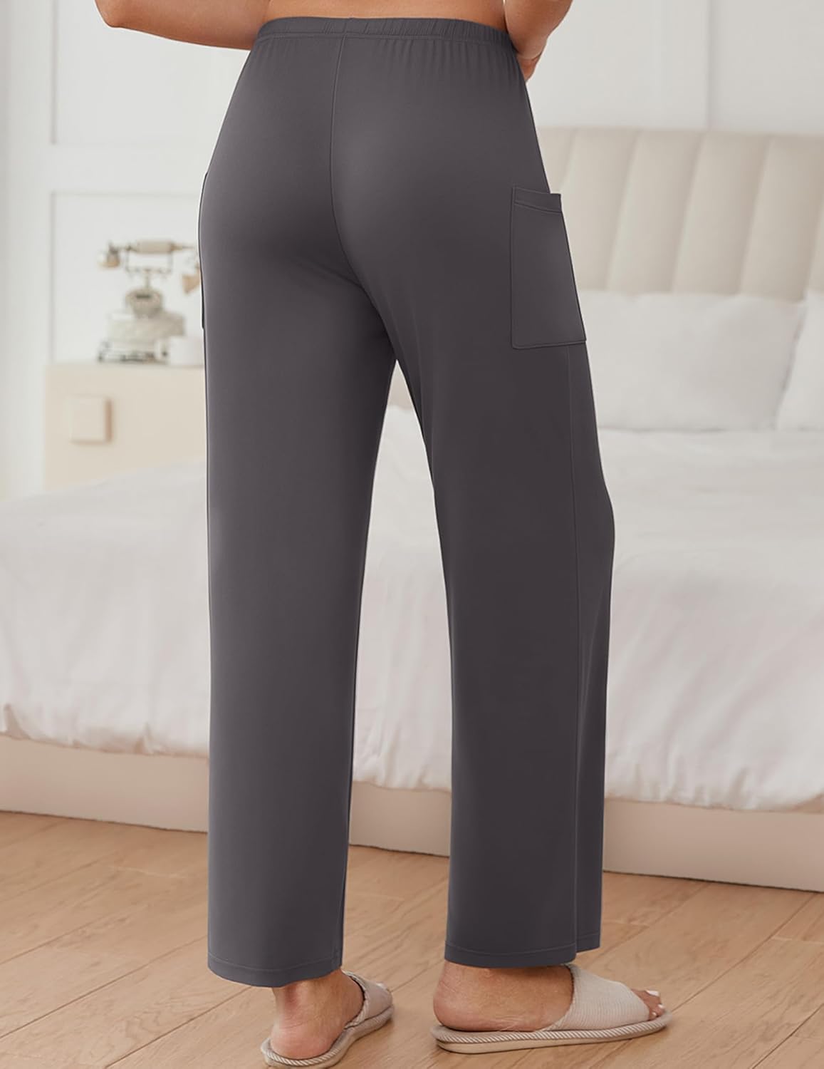 Dark gray lounge pants with side pocket, elastic waistband and straight wide legs