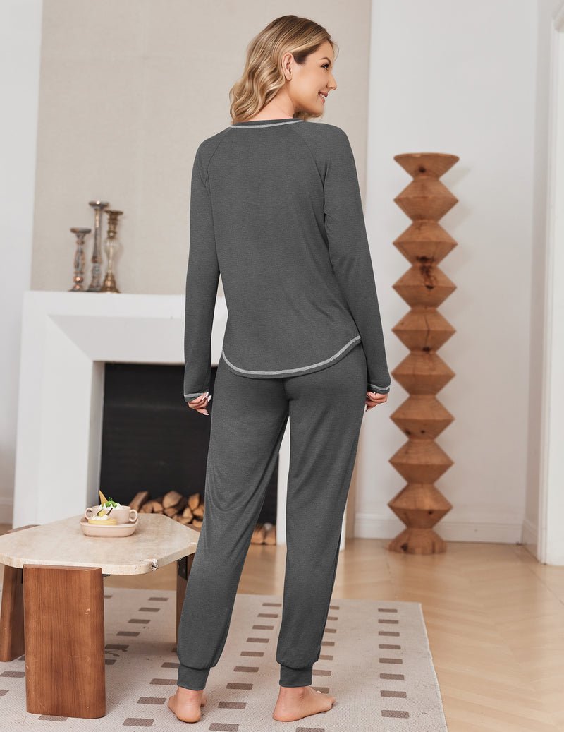 Dark grey long-sleeve pajama top with matching jogger pants, solid contrast trim