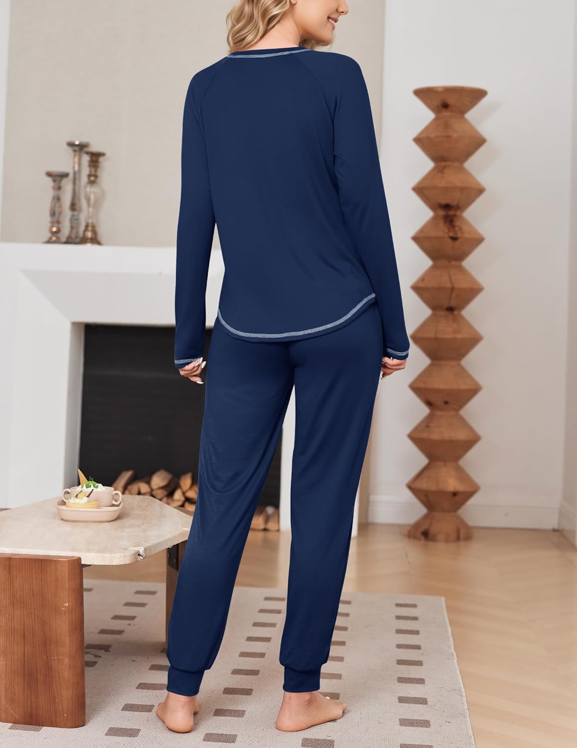 Back view of solid navy long-sleeve pajama top and joggers with contrast trim